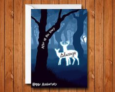 a greeting card with an image of a deer in the woods and text happy anniversary