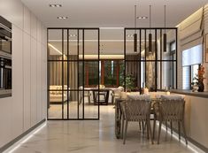 an open concept kitchen and dining area with glass partitions in the center, along with marble flooring