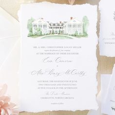 the wedding stationery is laid out on top of some papers and paper with flowers