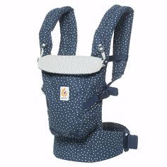 a blue and white polka dot baby carrier