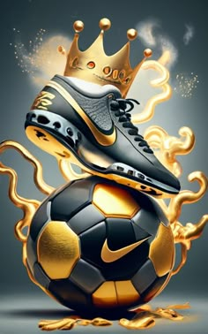 a soccer ball with a gold crown on top and a black shoe sitting on it