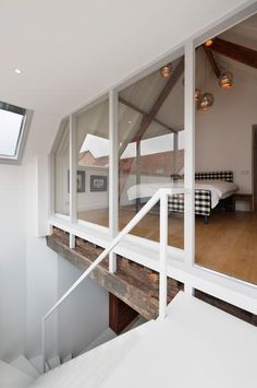 the interior of a house with large windows