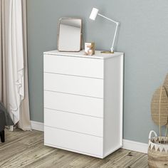 a white chest of drawers in a room