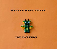 a brooch that is sitting on top of a piece of paper with the words miller west texas