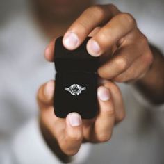 a man holding a ring in his hand