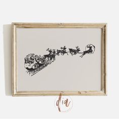 a framed drawing of santa's sleigh with reindeers