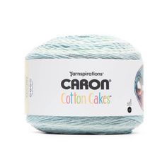 yarn ball in light blue and white with the words,'congratulations carbon cakes'on it