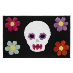 a rug with a skull and flowers on it