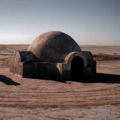 an outhouse in the middle of nowhere with no roof or walls, and only one door