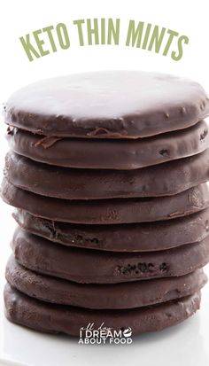 a stack of chocolate cookies with the words keto thin mints on top in front of it