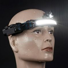 a mannequin head with a light on it's head and a flashlight in its forehead