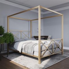 a white bed with gold frame in a room