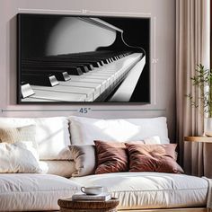 a living room with a couch, coffee table and piano on it's wall