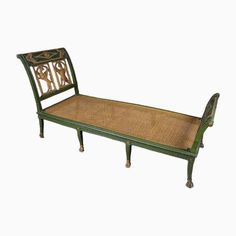 an antique wooden bed frame with wicker seat