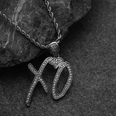 Introducing our exclusive Weeknd XO Necklace, a stunning homage to the musical genius of Abel Tesfaye. Crafted with precision from stainless steel and adorned with white enamel, this pendant is a symbol of The Weeknd's XO movement and his iconic albums, including Trilogy, Kissland, and Starboy. Embrace the enigmatic allure of The Weeknd's music with this exquisite pendant necklace. The XO symbol represents passion, loyalty, and the unwavering commitment of fans worldwide to Tesfaye's transformat Xo Symbol, Xo Jacket, Xo Necklace, Xo Jewelry, Abel Tesfaye, Swaggy Outfits, The Weeknd, Christmas Wishlist, White Enamel