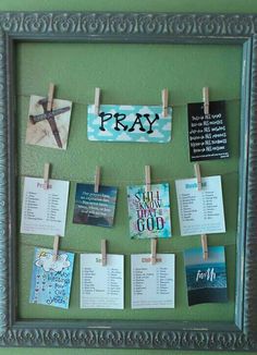 a bulletin board that has some pictures on it with clothes pins attached to it and the words pray