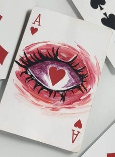 playing cards with an eye painted on them