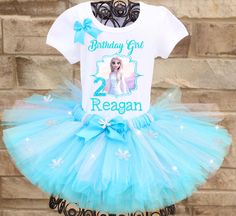 A stunning, glittery ice blue Elsa tutu outfit comes with a beautiful custom Elsa birthday shirt complete with your child's name and age. A coordinating bow is attached to the shirt as well. All tutus are made with high quality tulle and a 1" non-roll waist band. I make all my tutus very full and fluffy. I put as much tulle as I can possibly fit. The shirt is made with a professional heat press, NOT a home iron. Personalization is included at no additional cost. Please note, heat pressed shirts Elsa Birthday Outfit, Elsa Birthday Shirt, Frozen 2 Birthday, Tutu Size Chart, Elsa Tutu, Heat Press Shirts, Elsa Birthday, Birthday Tutu Outfit, Tutu Outfits