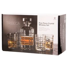 three pieces of crystal whiskey set sitting next to each other