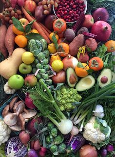 a pile of fruits and vegetables sitting on top of each other