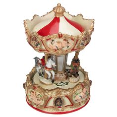 a carousel with figurines sitting on it's sides in front of a white background