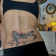 a woman with a tattoo on her stomach