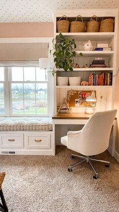 a white chair sitting in front of a window next to a desk and bookshelf