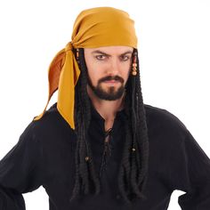 a man with dreadlocks wearing a yellow bandana