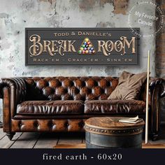 a leather couch sitting in front of a brick wall with the words break and room on it