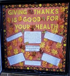 a bulletin board with leaves on it that says giving thanks is good for your health