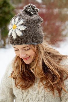 Our Daisy Collection is a modern version of our vintage daisy jumper. The iconic daisy motif is available on a bobble beanie, beanie, handwarmers or headband! Select one or mix and match to stay warm and stylish this winter. Choose from Denim, Bark or Red! D A I S Y ∙ A C C E S S O R I E S * Material: 100% Wool & 100% Polyester Fleece Lining * Quality and Sustainability: Handmade ∙ Fair Trade ∙ Slow Fashion * All our knitwear is handmade lovingly in Nepal * Most of our items have a FAUX leather logo either in a square or rectangle with our Pachamama brand. S I Z I N G * One Size * All our items are lovingly handmade which means that no two are exactly alike. * We want to ensure you get the best possible fit, please provide your relevant measurements and how you'd like the garment to fit so Cheerful Daisy, Daisy Headband, Knitting Group, Handmade Knitwear, Handmade Fair, Daisy Design, Knitted Flowers, Hand Knit Hat, Bobble Hats