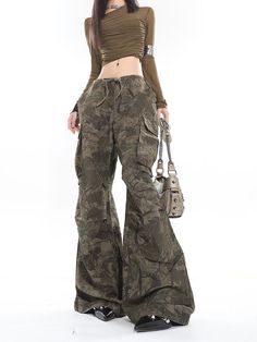 Unleash your inner rebel with these stylish Camo Low-Waisted Cargo Wide-Leg Pants, perfect for expressing your unique edge. Crafted to make a statement, these cargo pants feature a bold camouflage print and a relaxed fit, offering both comfort and a distinctive street-style flair. The durable material promises to maintain its shape and edgy look through your daily adventures. Pair these versatile trousers with a fitted tee for a casual day out, or elevate them with a sleek leather jacket for an Sims 4 Cc Camo Pants, Y2k Outfits Pants, Edgy Y2k Outfits, Style With Cargo, Camp Pants, Camo Outfit, Camo Pants Outfit, Camouflage Cargo Pants, Camouflage Outfits