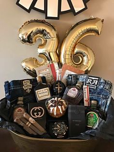 a large basket filled with lots of different items next to a clock on the wall