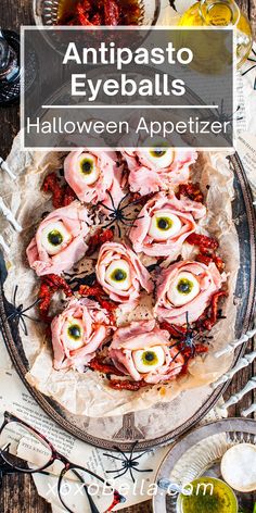 an image of food on a plate with the words antipasto eyeballs halloween appetizer