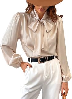 Look sophisticated and stylish in this Champagne Gold Satin Bow Tied Long Sleeve Top Blouse. Crafted with a luxe satin fabric giving it a smooth feeling and a bow tied at the front, this top is sure to be the perfect addition to any wardrobe. Materials: 97% Polyester, 3% Spandex Imported Drawstring closure Machine Wash XS = Dress 0-2, Bust, 31"-32.5", Waist 23"-24, Hip 31"- 34"Small = Dress 4-6, Bust,33"-35", Waist 25-26", Hips 35"-37"Medium = Dress 8-10, Bust 35-36" Waist 27-28", Hips 38-39"Large =Dress 12-14,Bust,38-40, Waist,29-31", Hips 40-42"14/16 - Bust 40"-42", Waist 33.5"-36", Hips 44"-46"18/20 - Bust 42"-44", Waist 37"- 40", Hips 47"-50"22/24 - Bust 44"-46", Waist 41"-46", Hips 51"-55"26/28 - Bust 46"-48", Waist 47"-50", Hips 56-60" Bow Tie Blouse, Fearless Women, Gold Satin, Large Dress, Satin Shirt, Satin Blouse, Satin Bow, Small Dress, Champagne Gold