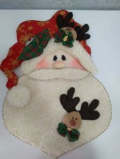 a stuffed snowman with reindeer antlers on it's head