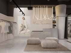 the interior of a clothing store with clothes on display