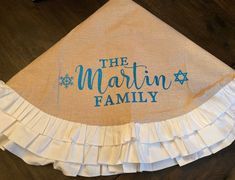 the martin family towel on top of a wooden table