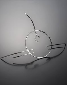 a pair of metal scissors sitting on top of a table