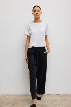 Cut in our shape-holding, 100% cotton, the Margo Tapered Pocket Pant is an easy, pull-on style pant with a straight, relaxed leg and a comfortable elastic waistband. Match it with our best-selling Margo Tee in Black. Shop all styles in this fabric group Style Pant, Satin Set, Everyday Chic, Fabric Shoes, Black Shop, Black Xs, Margot Robbie, Classic Dress, Pocket Pants