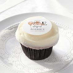 a cupcake sitting on top of a white plate