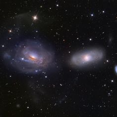 two spiral galaxy like objects in the sky