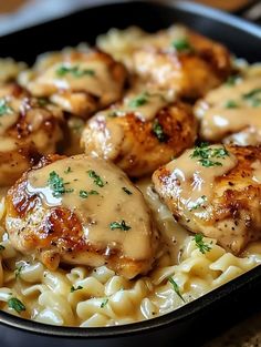 chicken and noodles with gravy in a skillet