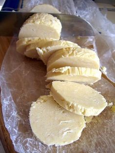 peeled bananas are sitting on a piece of wax paper