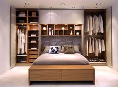 a bedroom with a bed and closets in it