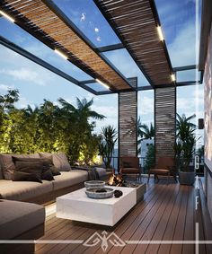 an outdoor living room with wood flooring and furniture