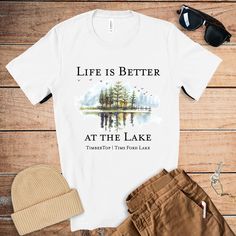 Life is better at the Lake Custom Tshirt. Personalize this tshirt with your lake house name or the name of the lake you live on (or both!) This beautiful watercolor design with fun saying is perfect for that special unique gift.For Personalization: write name or lake you would like added to the bottom of the design in the personalization box.PRODUCTION AND SHIPPING* Processing is 1-3 days.* First Class Shipping is 2-5 business days (after processing time)S I Z E* This style is a unisex* Size Cha Lake Shirts, Monogramming Ideas, Lake Theme, Lake Life Shirt, House Name, Lake Vacation, House Names, Custom Tshirt, Summer Lake