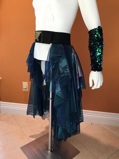 a mannequin wearing a skirt with sequins on it