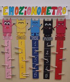 a bulletin board with different numbers and monsters on it's sides that are pinned to the wall