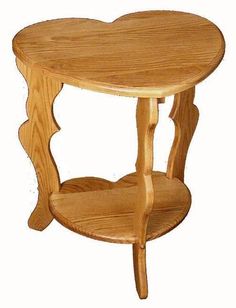 a wooden table with a heart shaped shelf on the top and bottom section, against a white background